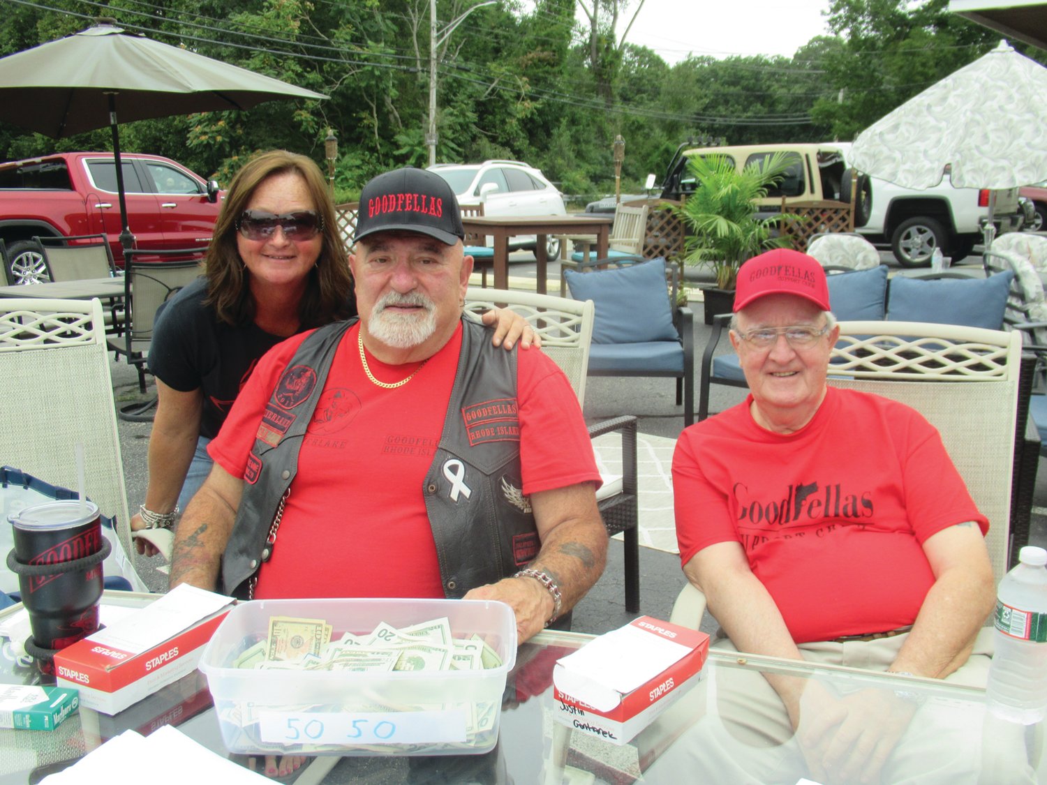 TERRIFIC TRIO: Bruno Ramieri (right) promised to match up to $20,000 for each dollar the Goodfellas Motorcycle Run took in, sits alongside Linda and Cal Calabro at the registration table helping out for Saturday’s 5th annual run.   